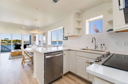 Villa Sabine Townhouses Villa | Fully renovated waterfront townhome with kayak, SUP, bikes, wagon, chairs, tent!