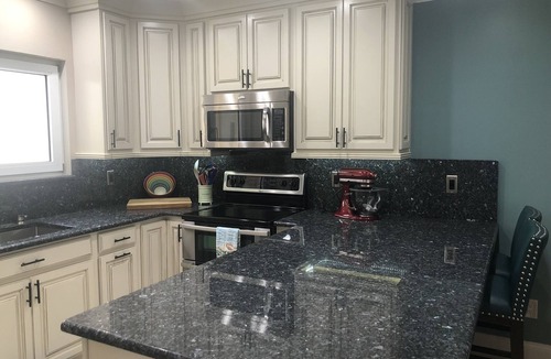 St. David's Island House | Gated Grand Harbor Townhome with beautiful views of the golf course and water