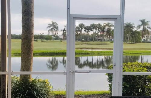 St. David's Island House | Gated Grand Harbor Townhome with beautiful views of the golf course and water