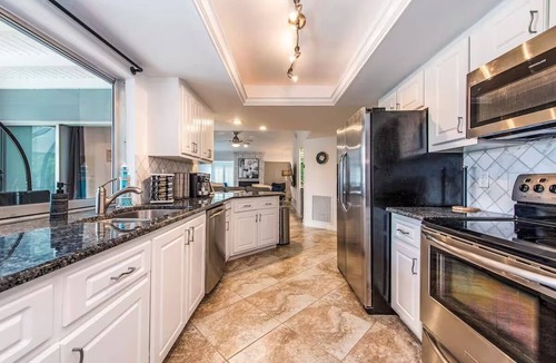 Palm River Estates House | Gorgeous Heated Pool and Hot Tub Home!