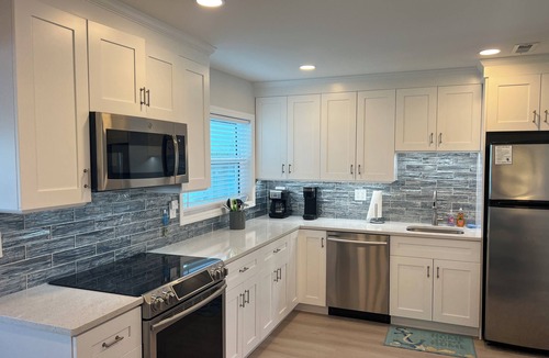 Englewood Condo | Ground floor Bay front, heated pool, dock, private beach access onsite.
