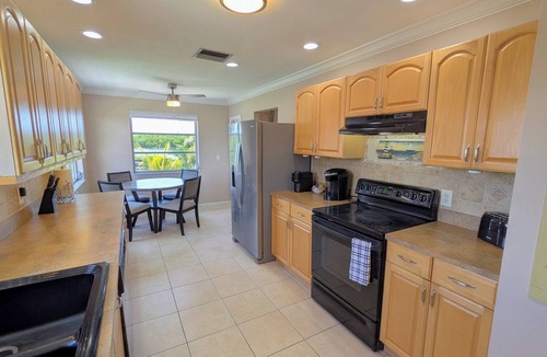 Estero Bay Shores House | Gulf Access Canal 3 BR Home: Bring your Boat, Kayaks, Game Room, Gym, Hot Tub