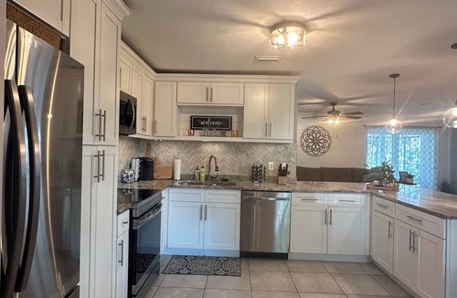 Caloosahatchee House | Gulf access pet friendly waterfront oasis with NEW heated salt water pool & spa