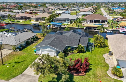 Caloosahatchee House | Gulf access pet friendly waterfront oasis with NEW heated salt water pool & spa