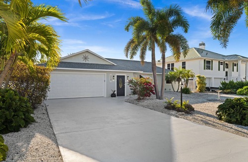 Saint James City House | 🌴Heated Salt Water Pool - Waterfront - Pool Table. 2420 Sapodilla Ln | St James City | 2 Bedroom 2 Bath. Welcome to your private slice of paradise—where laid-back island charm meets elevated coastal comfort.