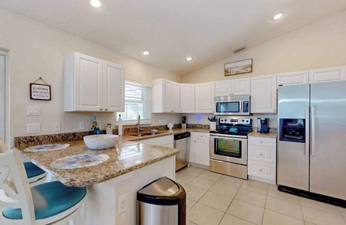 Englewood East House | Inviting home w/screened pool, lovely patio & upgraded interior - beach nearby