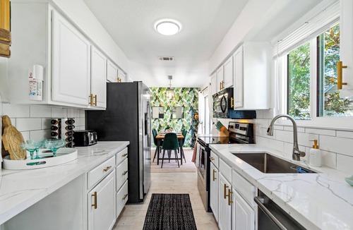 Jupiter Landing House | Jupiter Palm Oasis! Lakefront Pool Home w/Game Room, BBQ, Beach Chairs, Coffee!