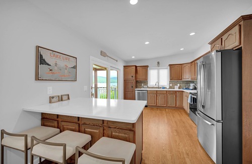 Hewitt House | Lakefront Haven Private Dock Private Beach Fire Pit Game Room