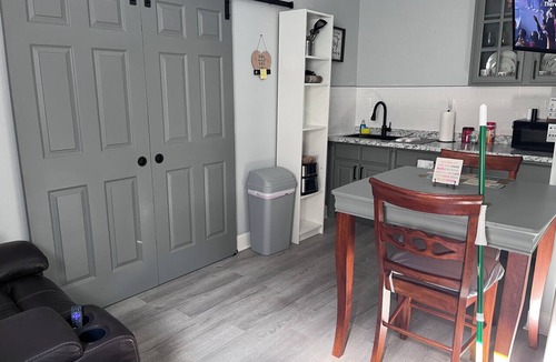 Tampa Heights House | Location Location Mini Jr. Suite. 1-bedroom queen bed behind barn doors.