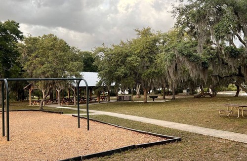 Braden River RV Rental | Luxurious Deluxe Safari Tent with King Bed and Outdoor Fire Pit in Bradenton, Florida