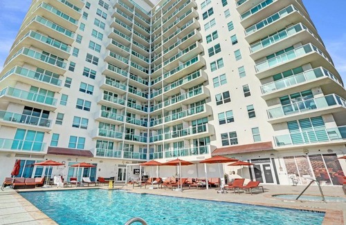Coconut Grove Apartment | Modern 1BR at Arya Bay Views with Balcony and Pool