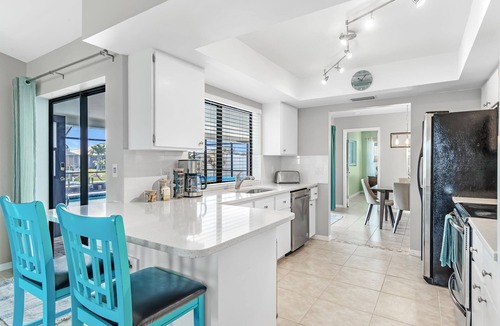 Cape Coral House | Modern Coastal Waterfront Retreat with Heated Pool & Dock