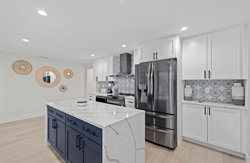 Shell Harbor House | Nestled along a pristine canal with long range views, this meticulously crafted residence defines coastal luxury at its finest.NEW!