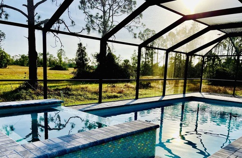 Jacarandas House | New heated pool/spa overlooking natural florida preserve.