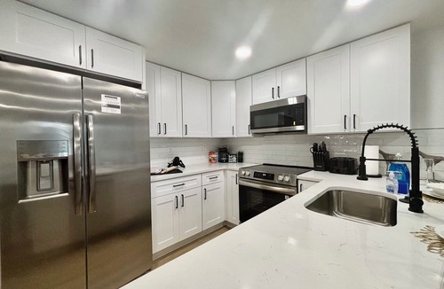 Seminole House | NEW! Rare 5 bedroom house w FREE HEATED POOL & HOT TUB 9 minutes to the beach!