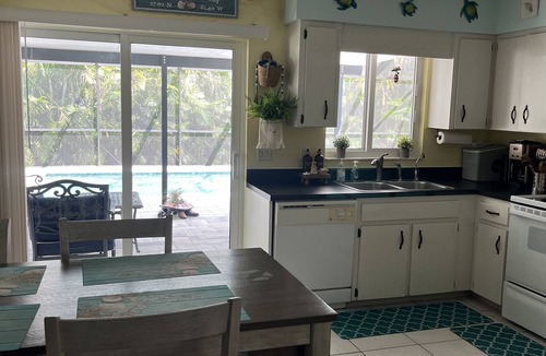 South Venice House | Palms and Pineapples- Tranquil Pool Home near Manasota Key and S Venice Beaches
