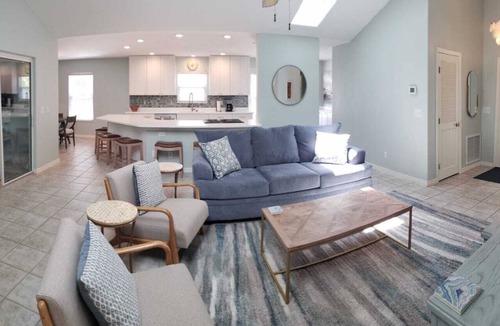 Butler Beach House | Paradise by the River - Relax in Style Near the Beach! Pool and Heated Spa