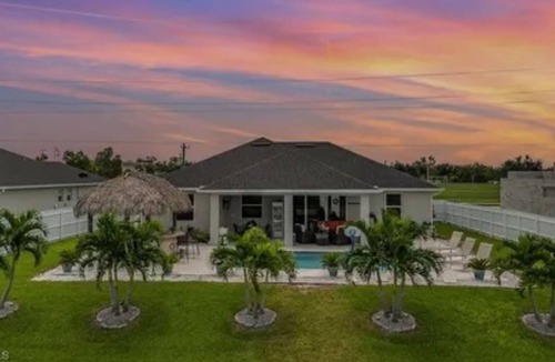 Trafalgar House | Paradise of Cape Coral on Canal, with Heated Pool, Tiki Hut Grill & Elec Bikes