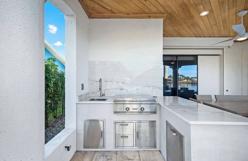 Pelican House | Paradise Palms Retreat - 5 BR (Sleeps 13) All New - Pool, Dock, Theatre + Games