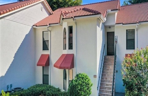 Pelican Bay Condo | Pelican Bay Condo overlooking pool and gardens, with private beach access.
