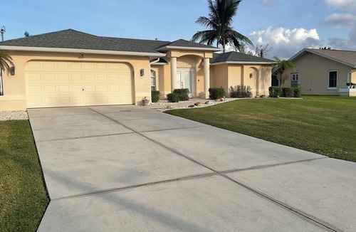 Fort Myers House | Remodeled pool home with upscale amenities and features, perfect for relaxing.