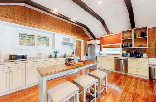Bonita Springs House | Riverfront dog-friendly cottages with kayaks, dock, patio, grill, & water views