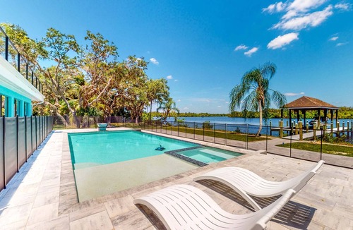 Fort Myers Shores House | Riverfront home - pool, pool spa, dock, & bikes