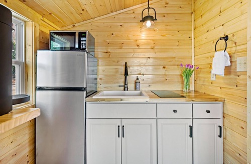 Old Fort Cabin | Romantic Treehouse with Hot Tub, Waterfall, Hiking, Swinging Bridge & Goats