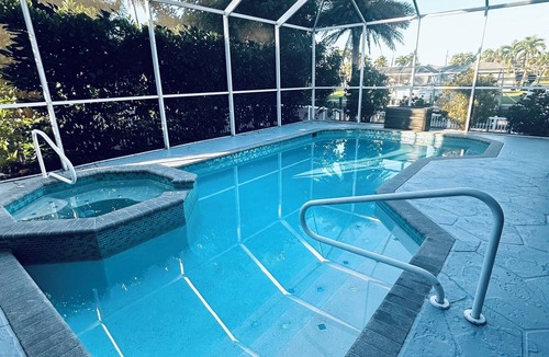 Yacht Club House | Spacious 4 bed 3 bath heated pool home with hot tub in prime Cape Coral location