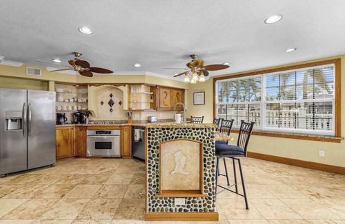 Pelican House | Striking European-style home w/private pool, hot tub & river access via dock