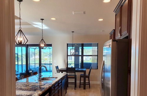South Gulf Cove Villa | Stunning home, pool overlooking river, free wifi, bikes, BBQ. Near beaches