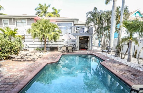 Mid Island House | Stylish home w. tropical landscaping, private pool + hot tub