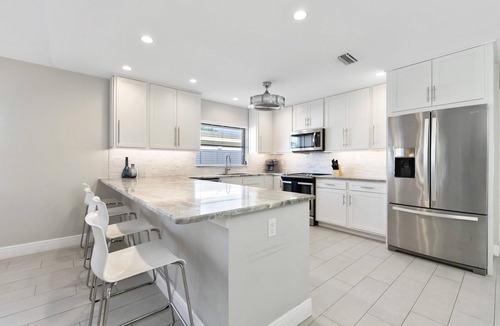 Naples Park House | SUMMER SPECIALS! Designer House, Heated Pool & Spa, close to beaches, FREE Bikes