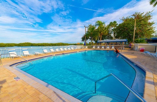 Ruskin House | Sunrise Waterfront 2BR Townhome - Pool & Private Terraces