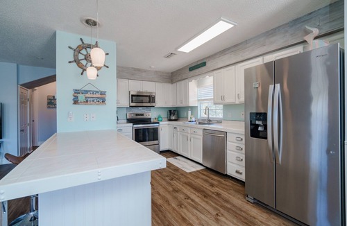 Holiday Beach House | Sunset Lagoon | 3BR Beach Home, Large Deck, Fenced Yard, Walk to Sand & Shops