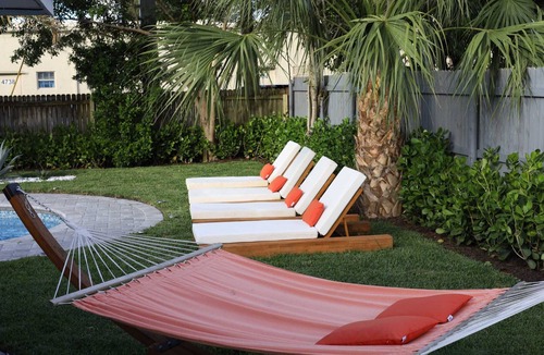 West Palm Beach Villa | The Coral Villa - Heated Pool Spa and Lush Garden