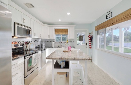 Jensen Beach House | The Jensen Beach Mermaid - Heated Pool/Spa, Pet friendly, beautiful lanai.