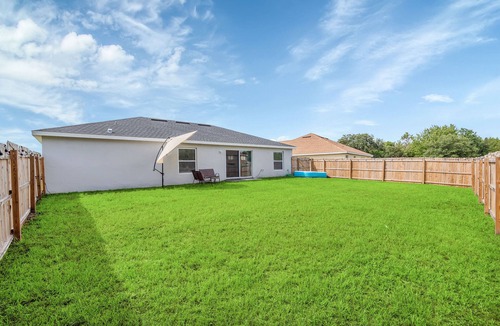 Poinciana House | THE MODERN OASIS - SPACIOUS 4 BDRM VACATION HOME. MINS. FROM DISNEY.