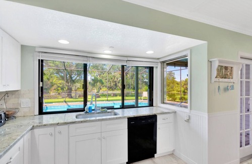 Lakeview Village House | The Oak house. HEATED Pool. Waterfront. Fire pit. Swings