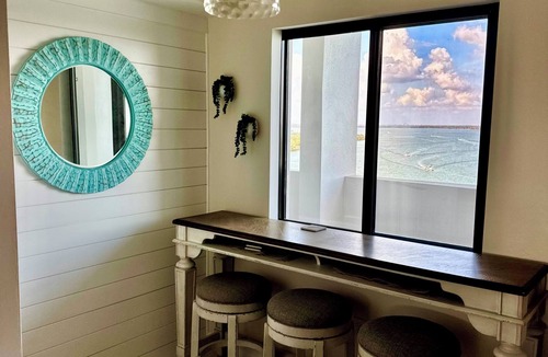 South Island Condo | Time to exhale. Sunrise from the balcony, and sunsets from the screened Lanai