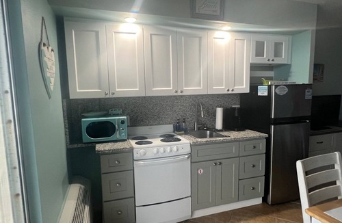 Bostwick Park Condo | Top Floor Oceanfront Studio with Balcony and Pools.