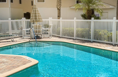 Indian Shores House | Townhouse Steps from the Beach with Screened Balcony, WiFi, AC & Shared Pools