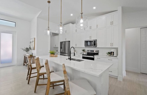 Bonita Springs House | Tranquil Bayfront Oasis – Dock, Heated Pool, Fire Pit + 5 Min to Beach