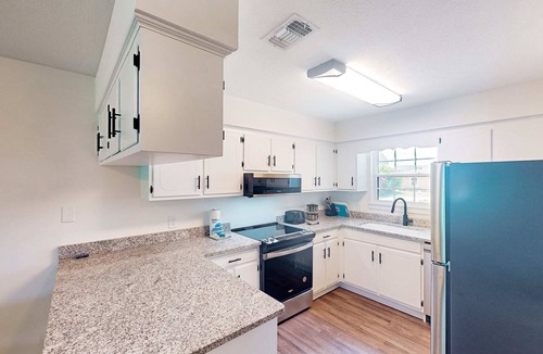 Panama City Condo | Two-story waterfront retreat with a furnished deck, washer/dryer, & AC