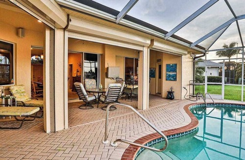 Naples House | Upscale waterfront home with private dock, saltwater pool, lanai, grill, & W/D