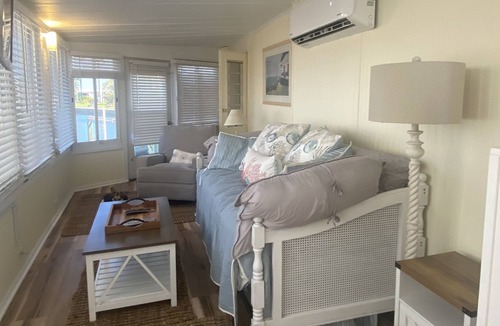 Nettles Island Cottage | Vintage cozy beach house waterfront on grand canal with dock