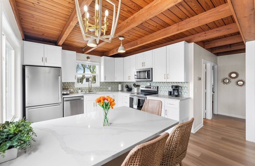 Butler Beach House | Waterfront | Pool | Canal | Game Room | Kayaks & Paddleboards