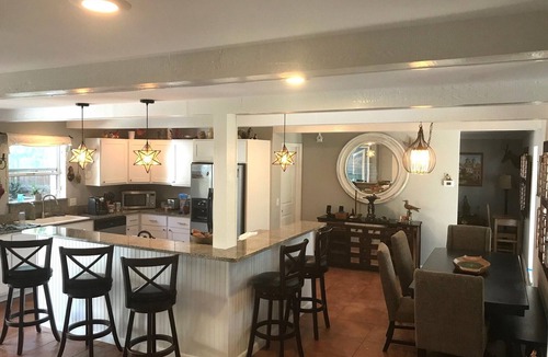 Central Beach House | Welcome to your tropical oasis steps from the beach!