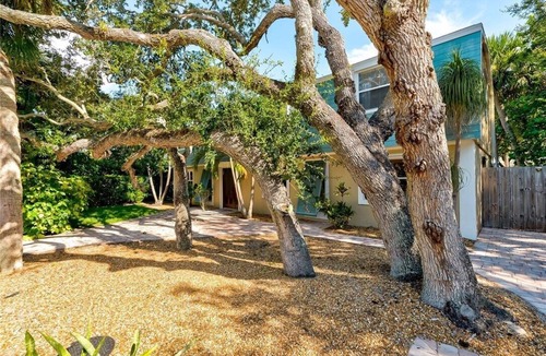 Central Beach House | Welcome to your tropical oasis steps from the beach!