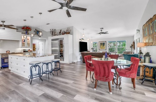 Truckland House | Your Hidden Florida Retreat | 4 King Suites, Luxury Kitchen, Heated Pool & Beach Adventures